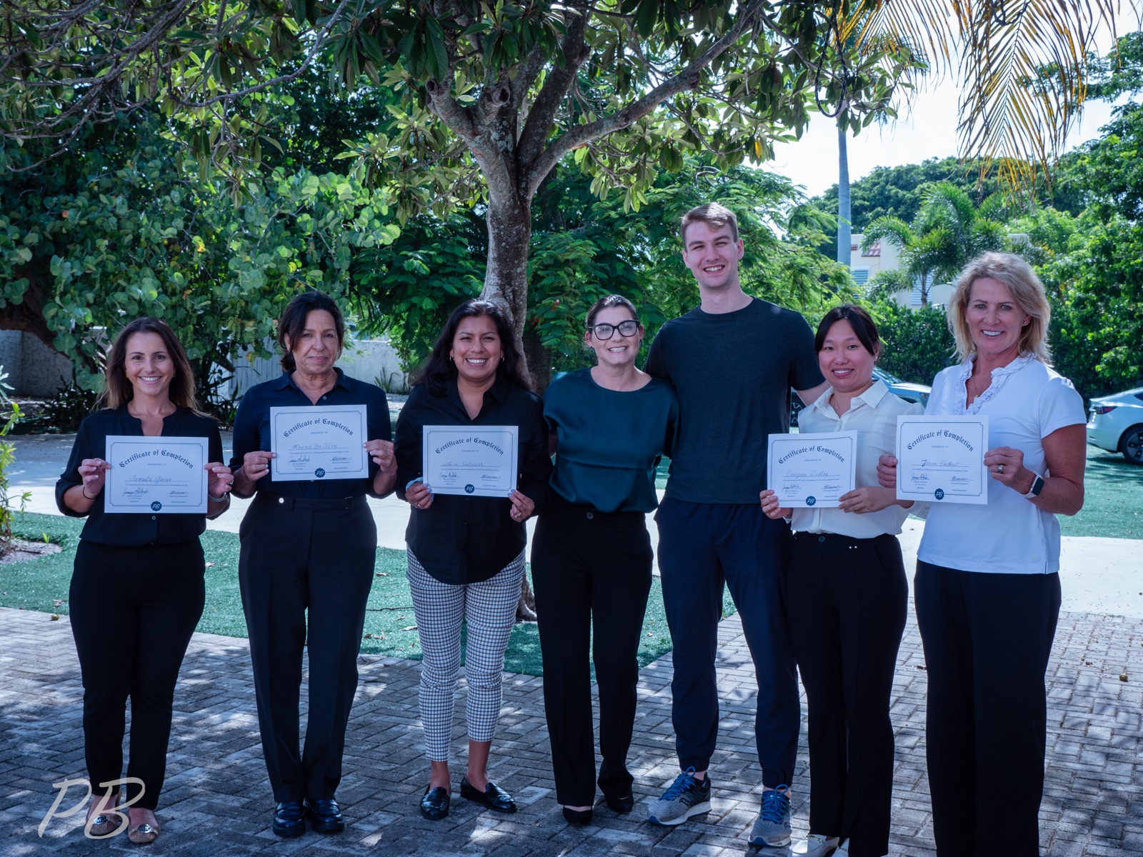 The first cohort with their certificates of graduation