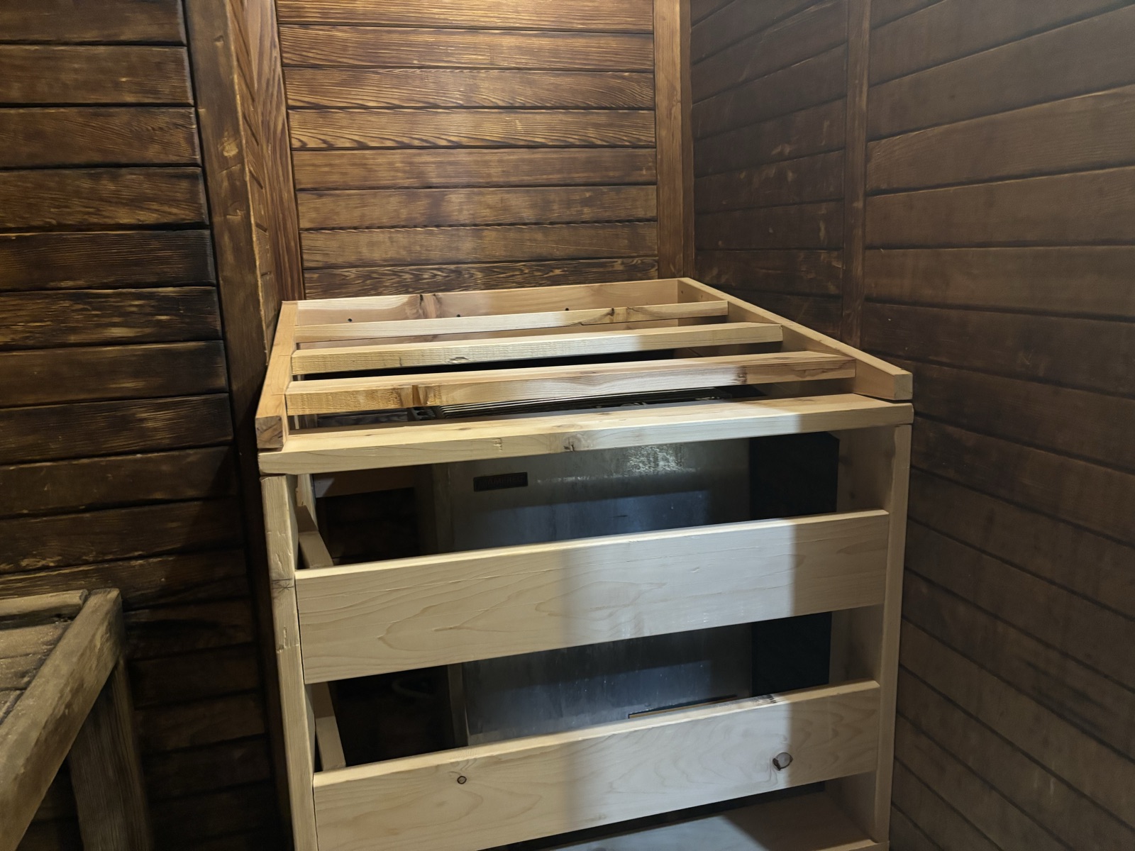 The finished sauna enclosure installed over the heater